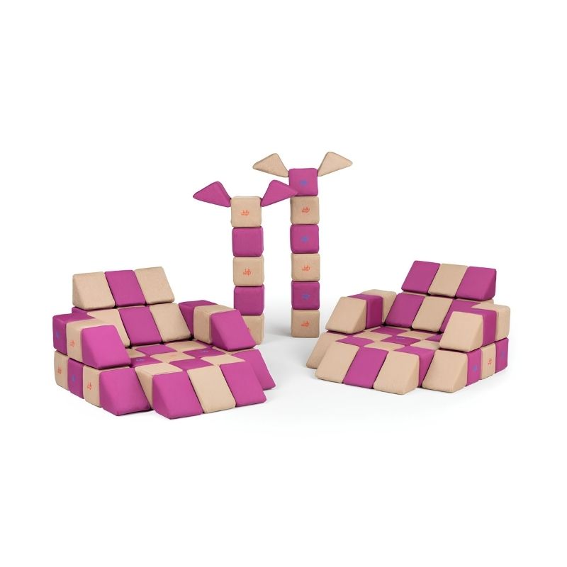 Two chair builds alongside tall tree-shaped towers made from JollyHeap Basic Set magnetic foam blocks, highlighting the variety of structures this soft play set allows.