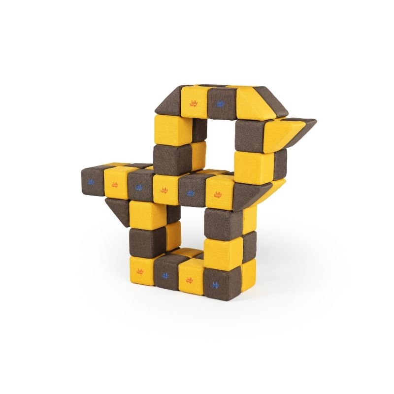 An angular sculptural structure built from JollyHeap magnetic soft blocks, showing complex construction possibilities