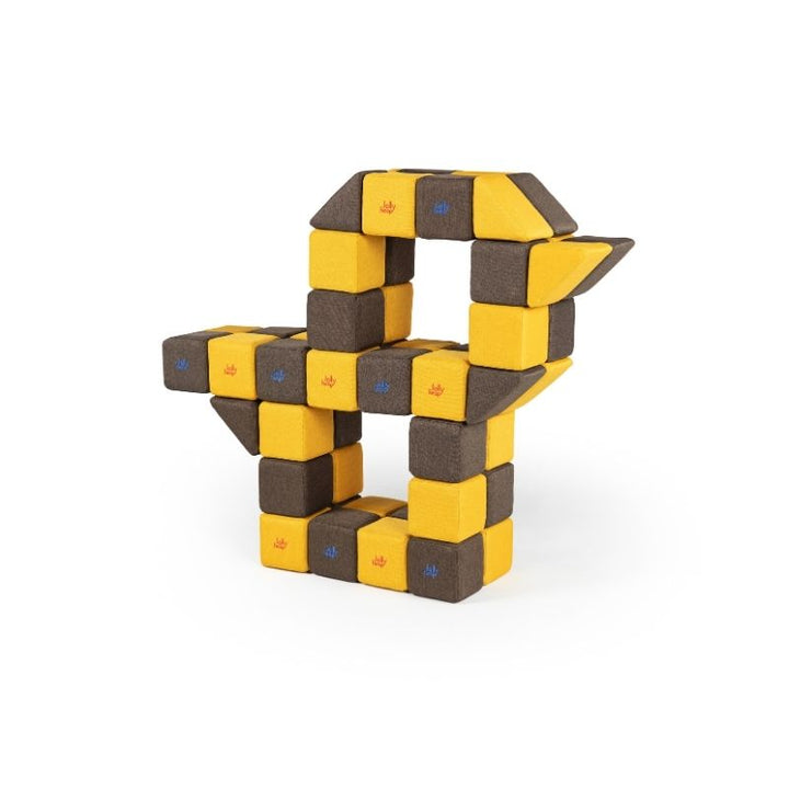 An angular sculptural structure built from JollyHeap magnetic soft blocks, showing complex construction possibilities