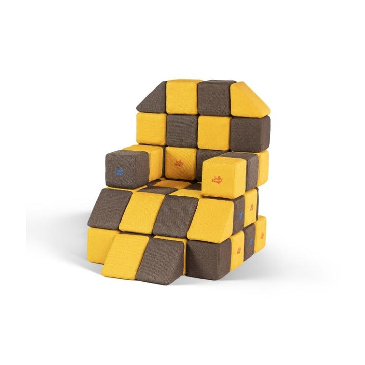 An armchair built from JollyHeap Medium Set magnetic soft blocks in a checkerboard pattern