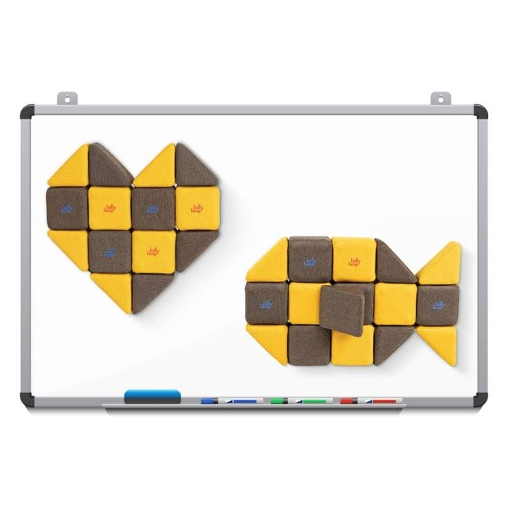 A heart shape and a fish shape built from JollyHeap Medium Set blocks and mounted on a magnetic whiteboard