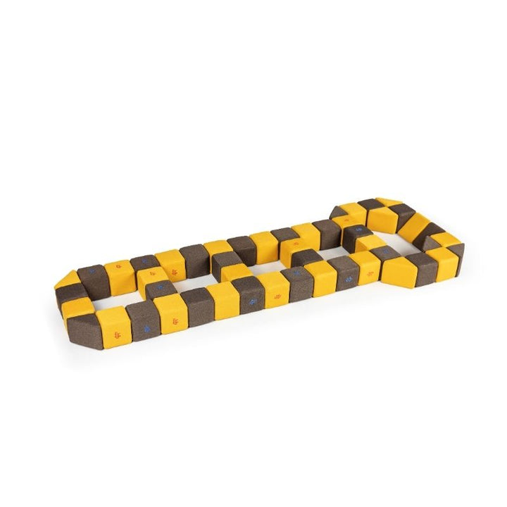 A winding flat path built from JollyHeap Medium Set magnetic soft blocks laid out on the floor