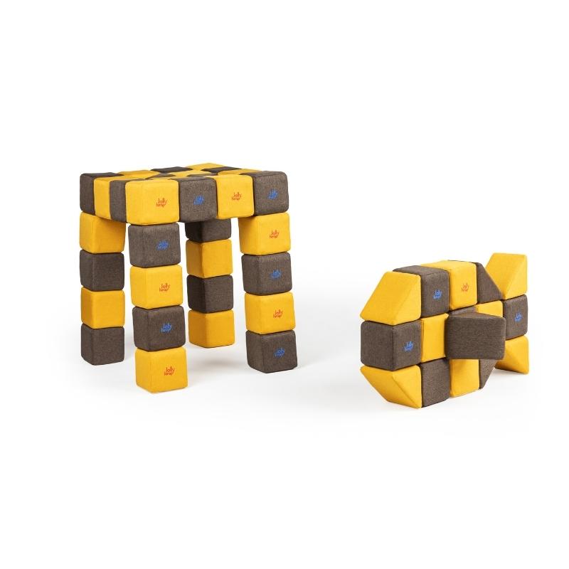 A four-legged stool and a fish shape built side by side from JollyHeap Medium Set magnetic soft blocks