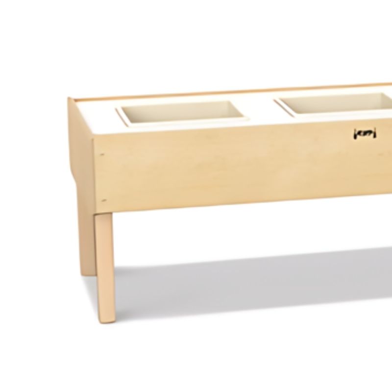 Left leg detail of the Jonti-Craft Toddler 3 Tub Sensory Table showing the Baltic Birch frame construction and ground-level leg design of this three-zone sensory table