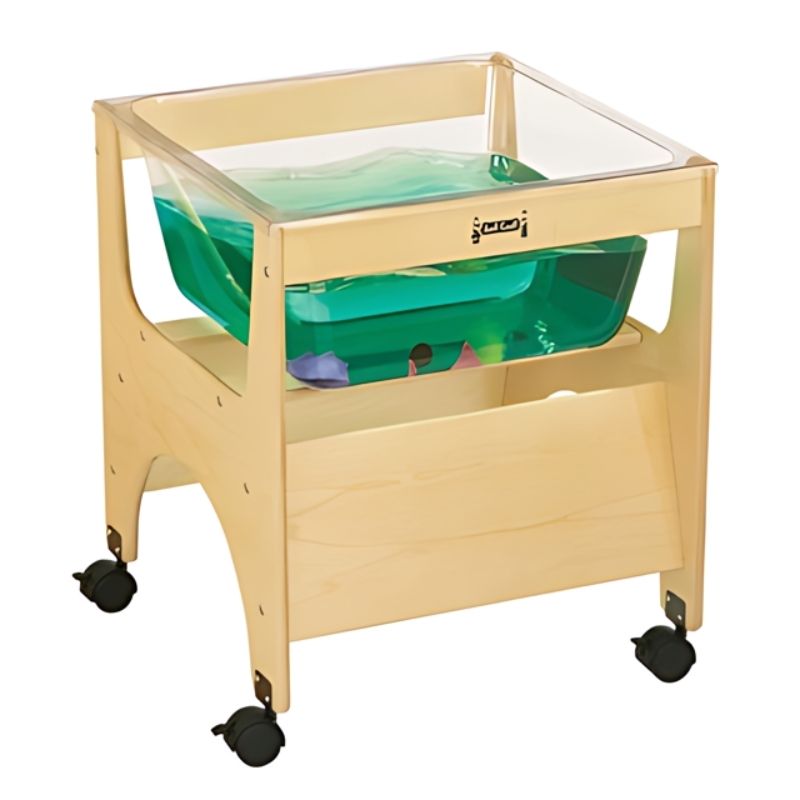 Jonti-Craft See Thru Mini Sensory Table 24-1/2" High landscape view showing the compact transparent acrylic tub, Baltic Birch frame, Lego-compatible cover plate, and locking wheels