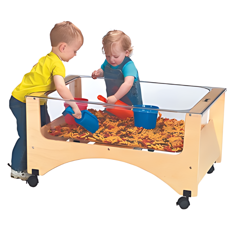 Child actively playing at the Jonti-Craft See Thru Toddler Sensory Table showing the transparent acrylic tub and 20-inch toddler-height design for daycare and classroom sensory play