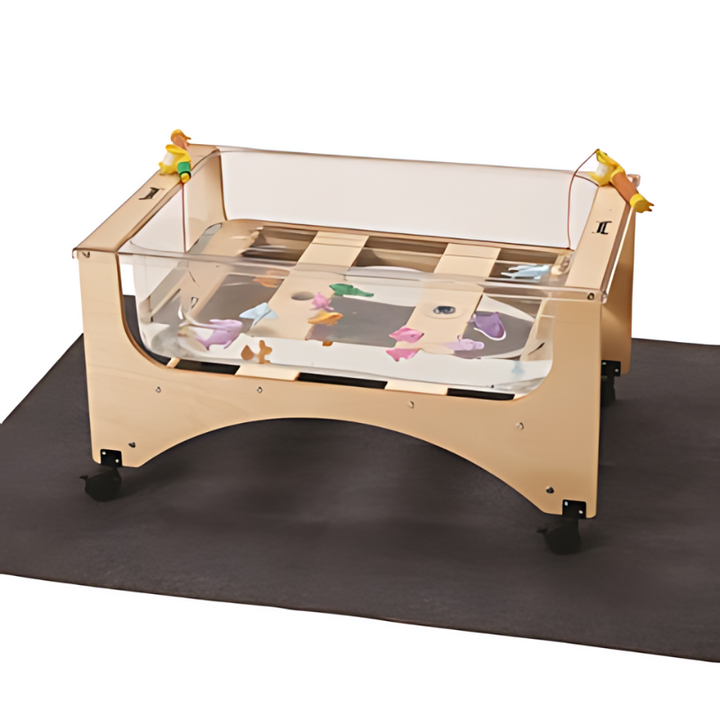 Jonti-Craft See Thru Toddler Sensory Table with grey platform accessory showing the clear acrylic construction and locking wheels of this Canadian-made toddler sensory table