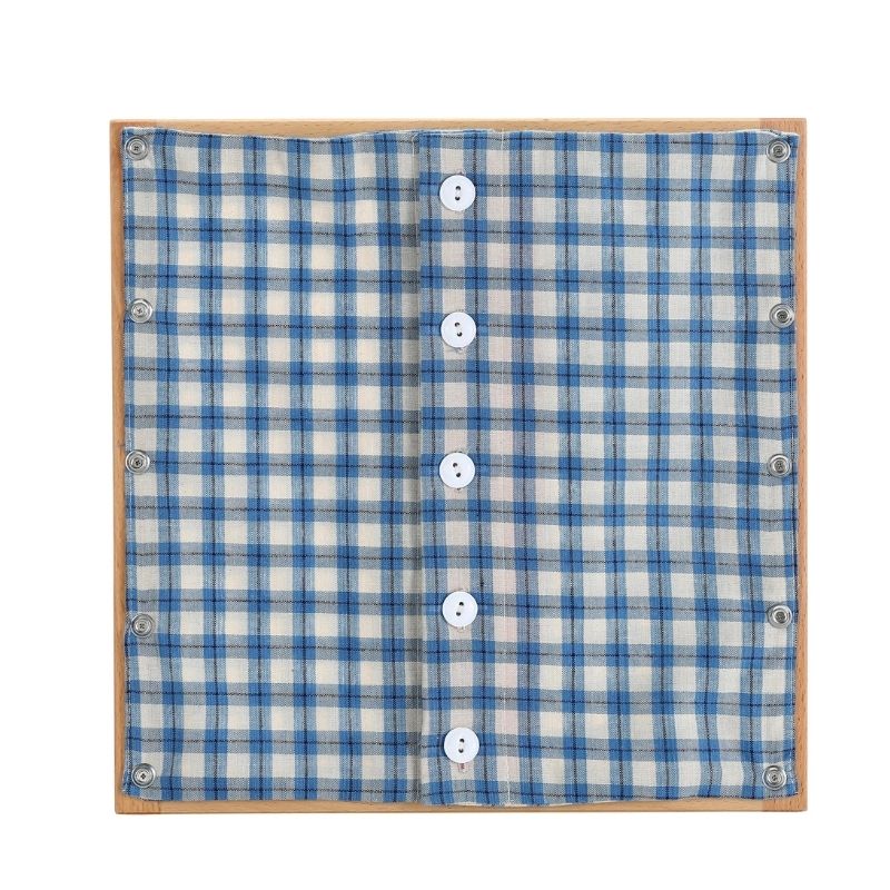 Kinderhuis Montessori dressing frame with white and blue fabric panel, AMI-approved beechwood material for fine motor skills