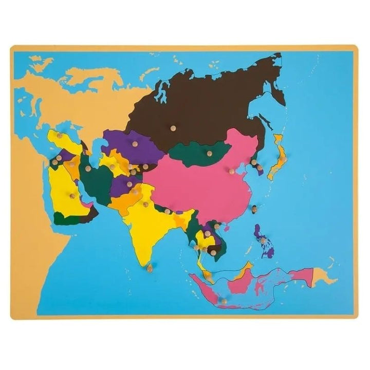 Kinderhuis Geography Cabinet Southeast Asia puzzle map showing laser-cut country pieces with capital-knob design for Montessori learning
