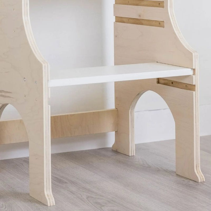Sapiens Child Kiwi Kitchen Tower bottom close-up view showing the stable base construction, non-toxic eco-friendly wood finish, and non-balancing design of the Vancouver-made learning stool