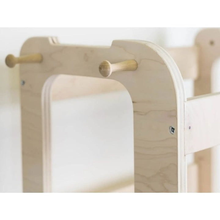 Sapiens Child Kiwi Kitchen Tower top close-up view showing the enclosed safety rail design, rounded corners, and standing platform of the Canadian-made adjustable toddler kitchen helper