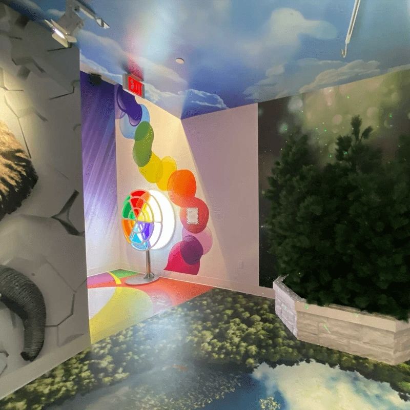 LiteZilla Chroma Wheel in active use, demonstrating real-time colour mixing as a user spins the dual acrylic panel wheels