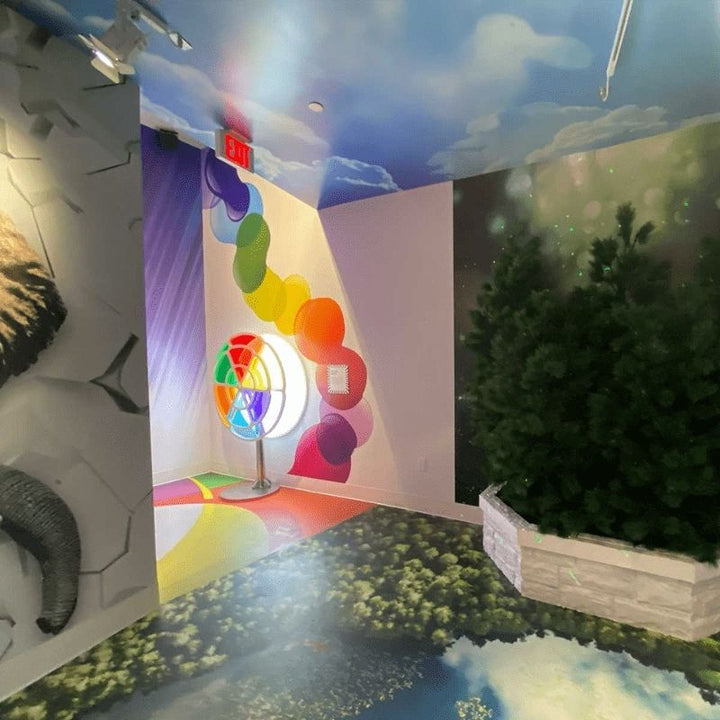 LiteZilla Chroma Wheel in active use, demonstrating real-time colour mixing as a user spins the dual acrylic panel wheels