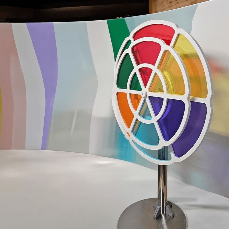 LiteZilla Chroma Wheel interactive colour mixing exhibit viewed from the side, showing the large and small spinning wheel configuration