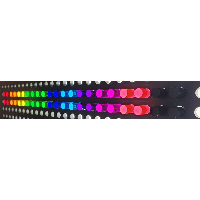LiteZilla Mini LitePins inserted into illuminated grid showing glowing colour display - acrylic sensory pins for LiteZilla Mini and IllumiTable