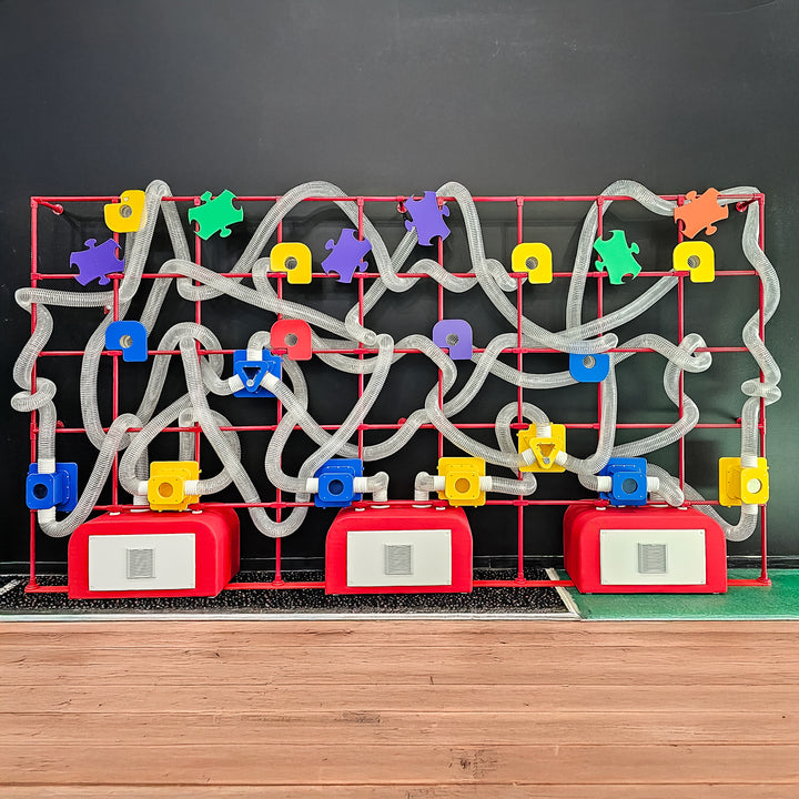 LiteZilla Ultimate Scarf Launcher front view showing full air-powered tube network for sensory play in schools and museums