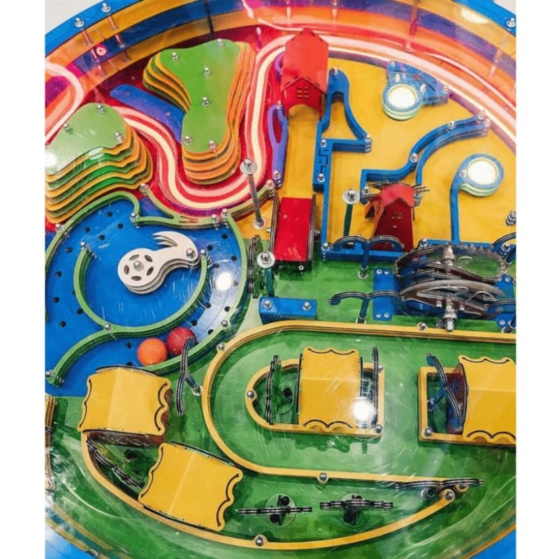 Overhead view of the LiteZilla Twistopia Tabletop Labyrinth themed circular maze board with ball and obstacle layout, designed to develop fine motor skills and critical thinking for all ages