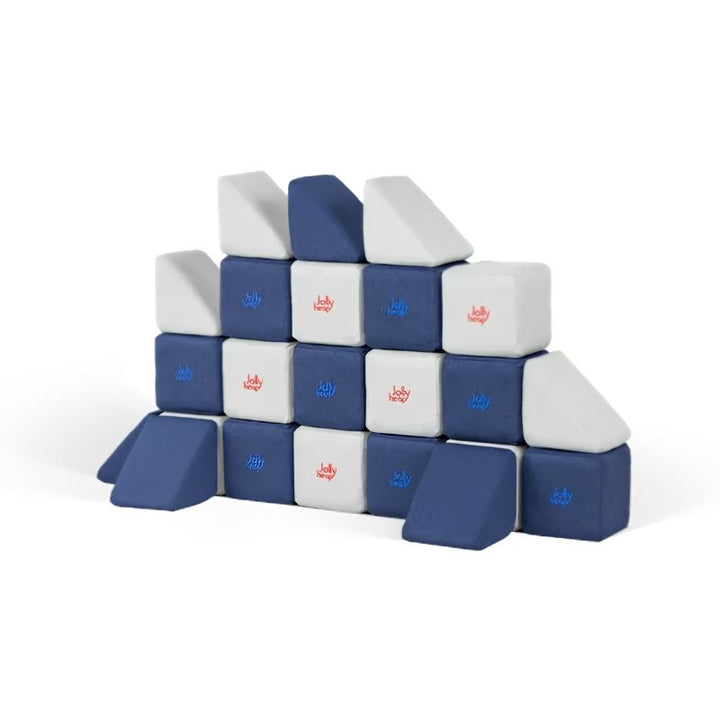 JollyHeap Mini magnetic block set arranged into a stepped wall, showing the soft fabric-covered cubes and triangles for toddler building play