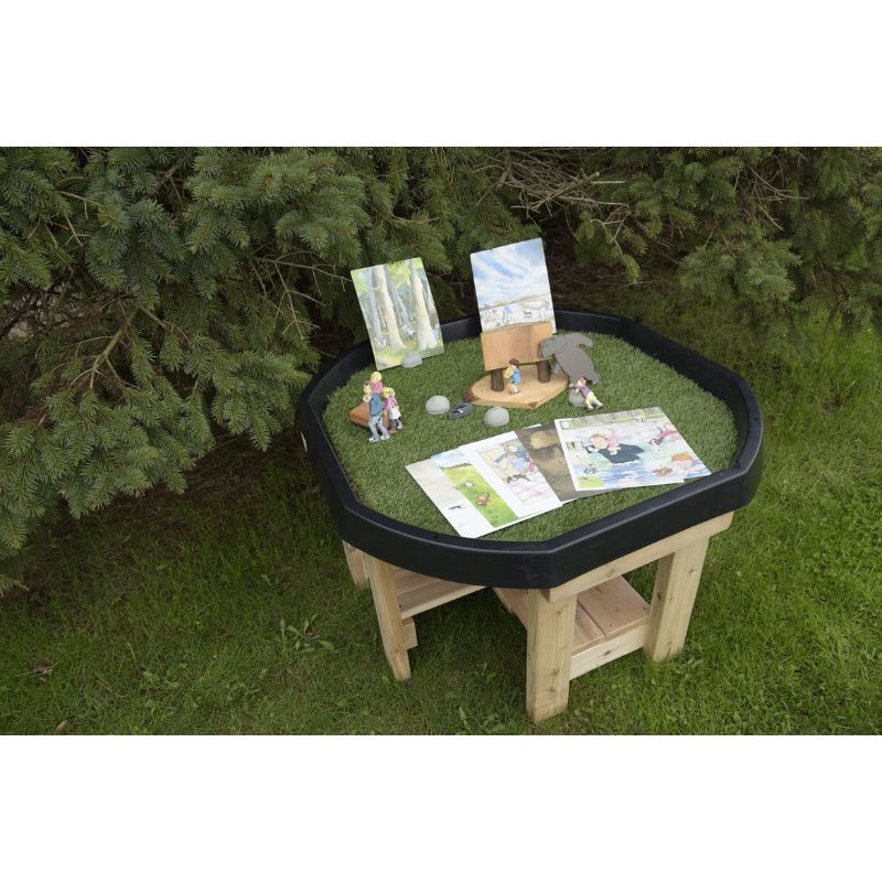 ONP Infant Active World Tray Stand 12" shown with accessories demonstrating the black Tuff Tray and cedar lower shelf in an outdoor early years sensory play and small-world provocation setting
