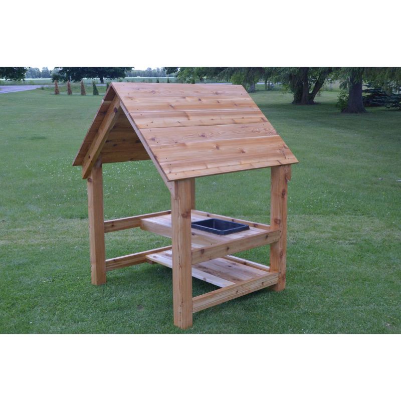 Side view of the ONP cedar Mud Kitchen House showing the sheltered roof structure and open-ended outdoor play kitchen built from North American Red Cedar