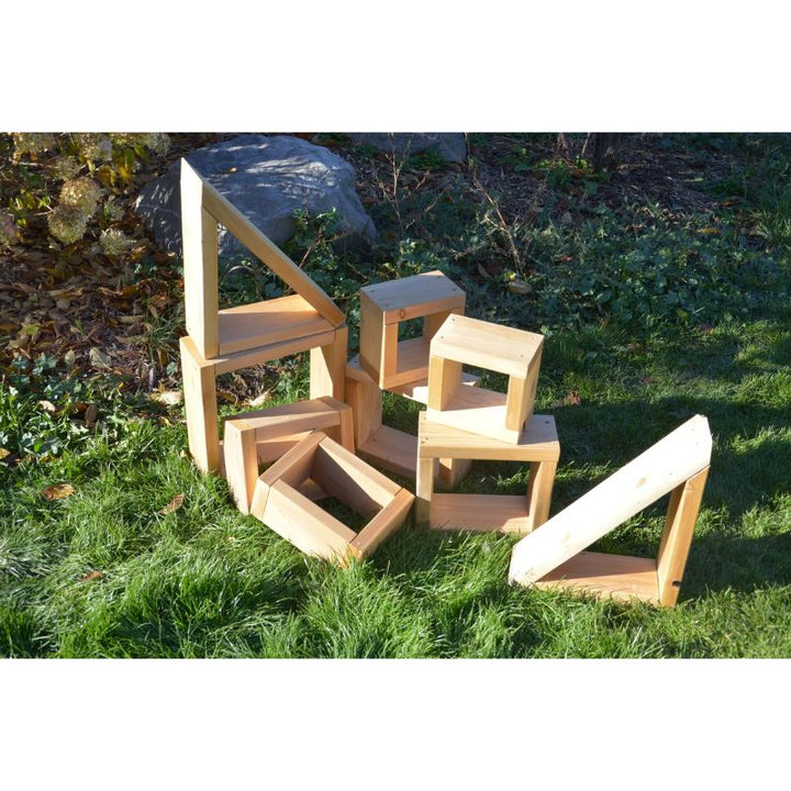 ONP 9-piece outdoor cedar block set in front portrait view, displaying the natural Western Red Cedar construction and open-base shapes for open-ended outdoor block play