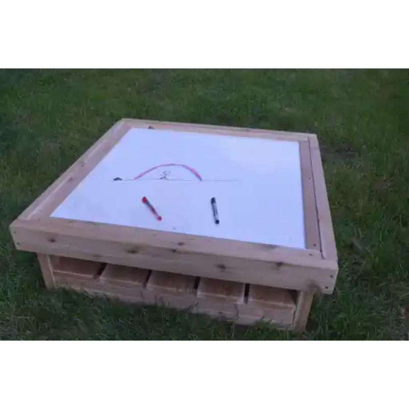ONP Outdoor Square Art Table preschool version with drawing on the white dry-erase surface, demonstrating outdoor mark making and creative play for early years classrooms and backyards