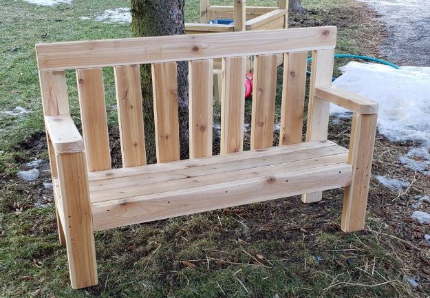 ONP Preschool Buddy Bench portrait view showing the full 48-inch Western Red Cedar construction, a natural wood outdoor buddy bench for early years playgrounds and school gardens across Canada and the US