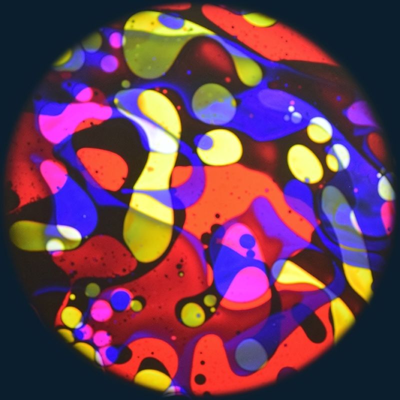 OPTIKinetics 6 inch Liquid Effect Wheel Tutti Frutti displaying its bright multi-colour oil-based lava lamp projection effect for Solar LED and Aura sensory projectors