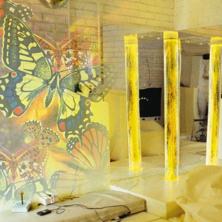OPTIKinetics Solar 100 LED projector casting yellow butterfly projections, demonstrating the high colour temperature and image clarity of the 20W LED module
