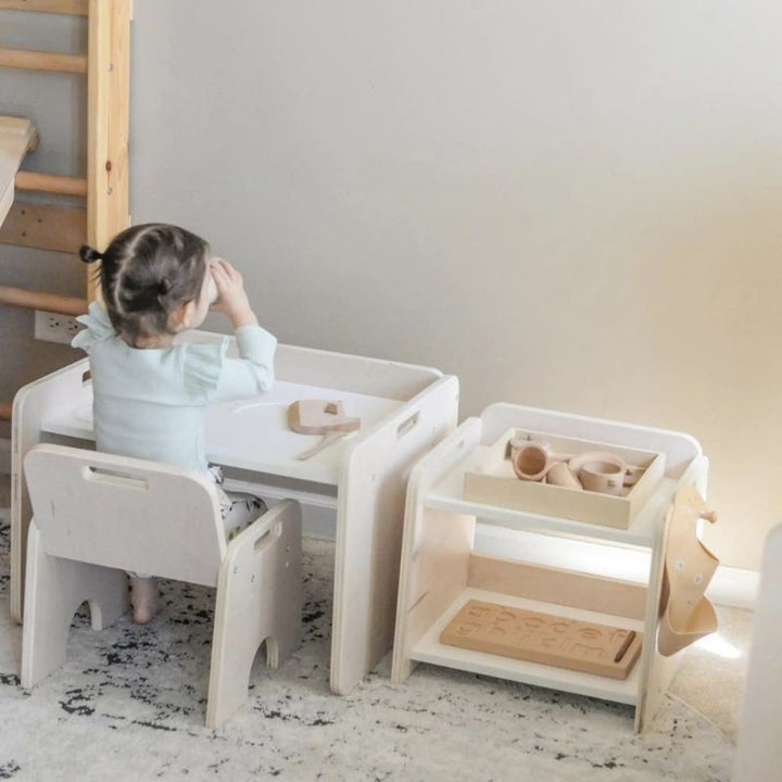 Child actively accessing items from the Sapiens Child Papaya Montessori Mini Shelf, showing the child-height design that supports independent reach for cups, jugs, and Montessori materials