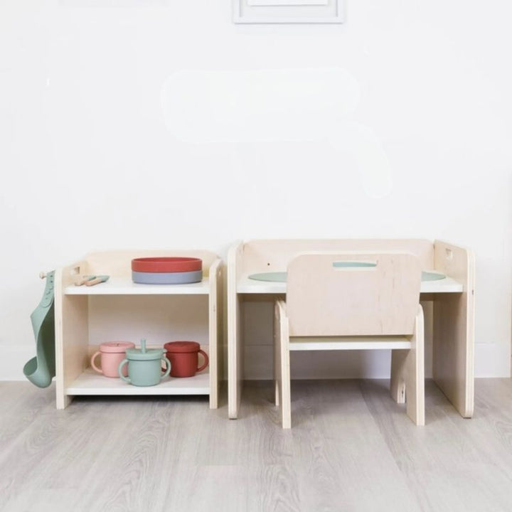 Sapiens Child Papaya Montessori Mini Shelf in an indoor home setting showing how the compact child-height organiser fits naturally into a kitchen or nursery environment alongside the Papaya weaning table