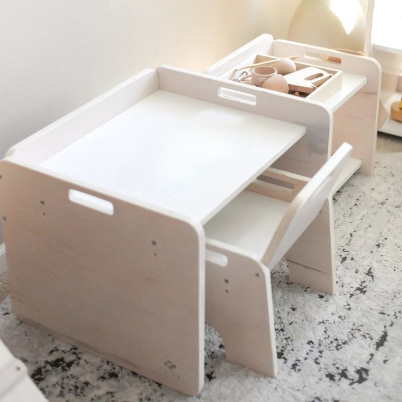 Top-down view of the Sapiens Child Papaya Set Montessori table indoors showing the 22.2 inch wide work surface, raised table borders, and eco-friendly maple plywood construction