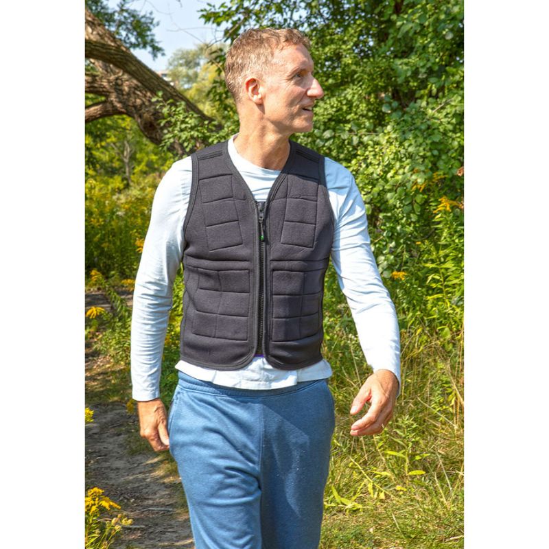 Adult male wearing Power WearHouse weighted vest for sensory regulation and bone health, front view outdoors