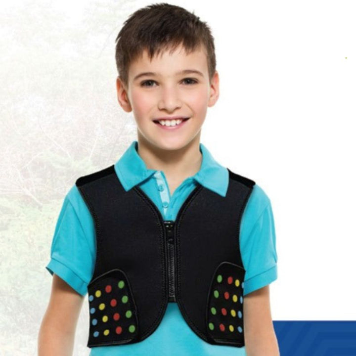 Boy in Power WearHouse ProPower Compression Vest showing front zipper and colour-coded hook and loop compression straps for sensory deep pressure input