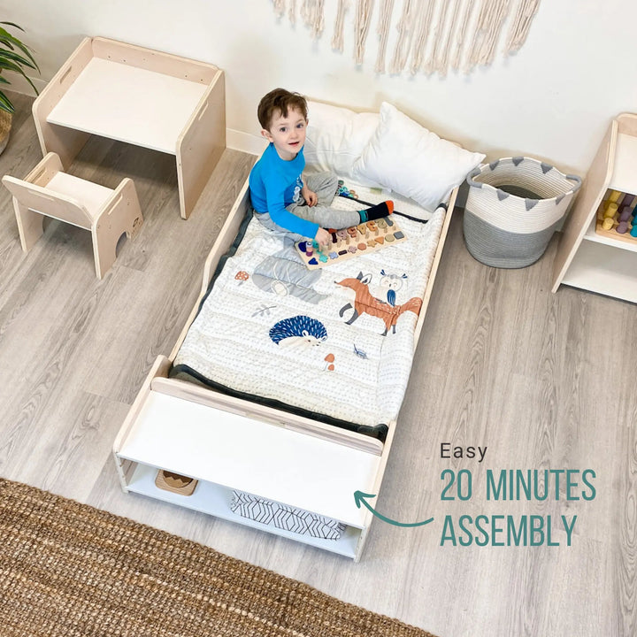 Sapiens Child Apple Montessori floor bed with rails in a clean landscape view showing the low-to-ground profile, protective borders, and FSC-certified plywood construction