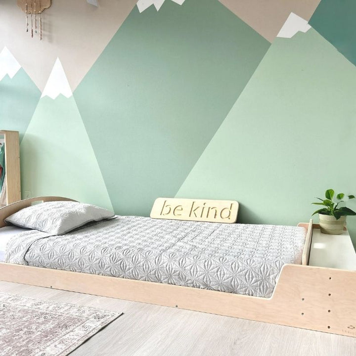 Second landscape view of the Sapiens Child Cherry Twin Montessori floor bed showing the full open low-profile frame and adjustable side shelf