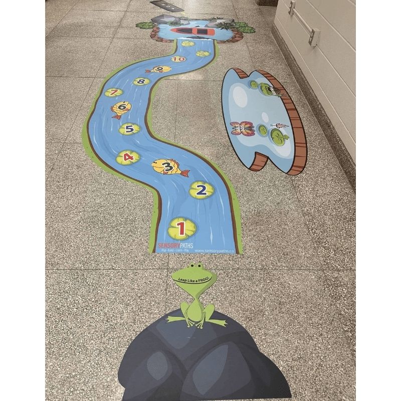 Sensory Paths Wild Wilderness Adventure floor path installed in a school hallway, showing the first section layout with hopscotch river and movement decals