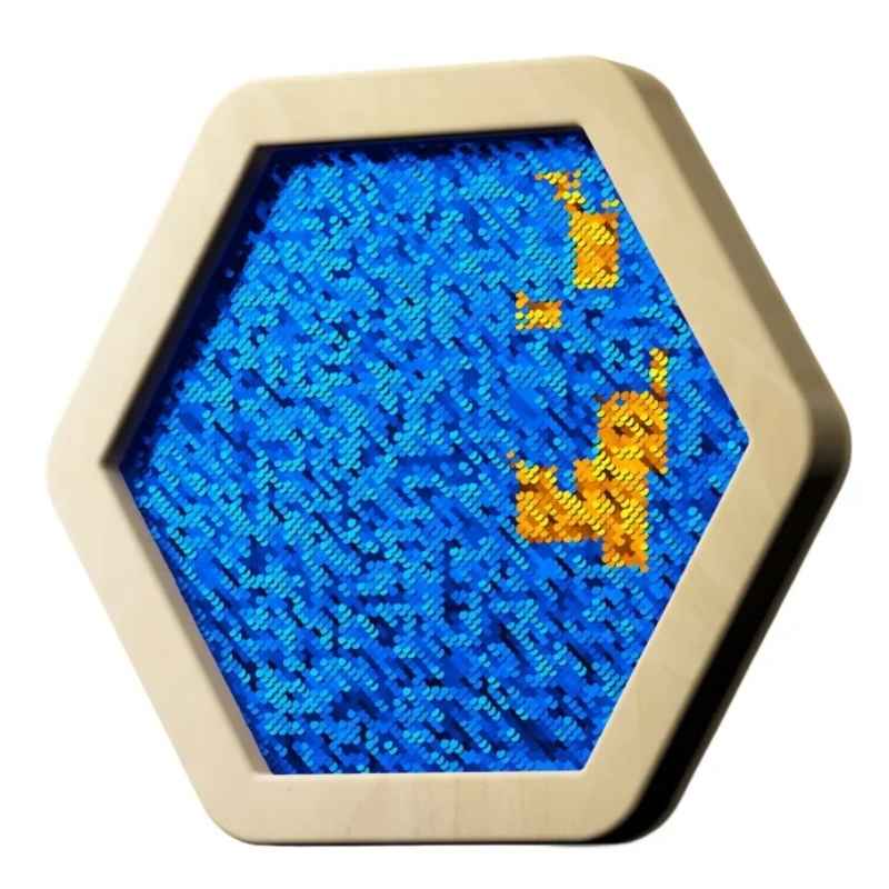 LiteZilla Sequin Flip Hexagon Panel in blue, an angled view of the gold and blue reversible sequin wall panel