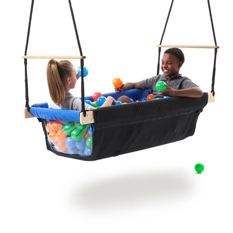 Two children swinging together inside the Southpaw Buddy Boat, a full-body vestibular therapy swing with enclosed soft fabric sides and clear vinyl viewing panel