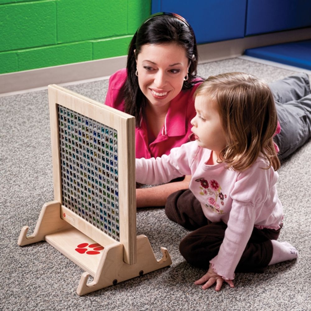 Adult and child using the Southpaw Mini Marble Panel together, a portable tactile sensory fidget panel for home and therapy use