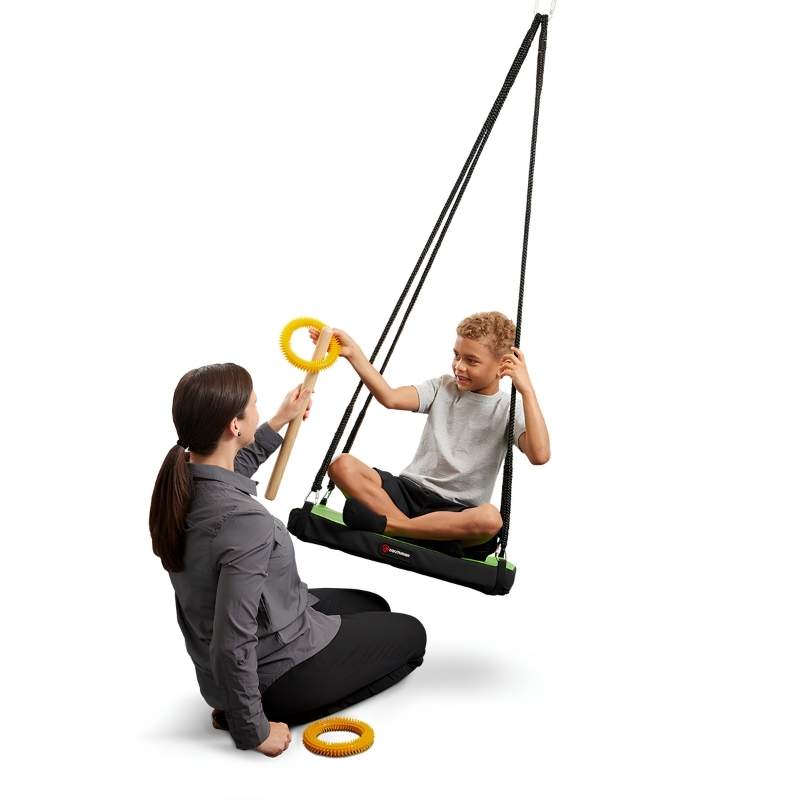 Child and adult using the Southpaw Soft-Lite Junior Glider sensory platform swing together, illustrating therapist-guided vestibular activity in a therapy setting