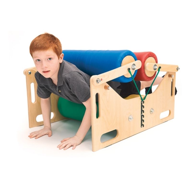 Boy crawling through the Southpaw Steamroller Deluxe foam rollers, demonstrating deep pressure sensory input and motor planning activity for home and therapy use