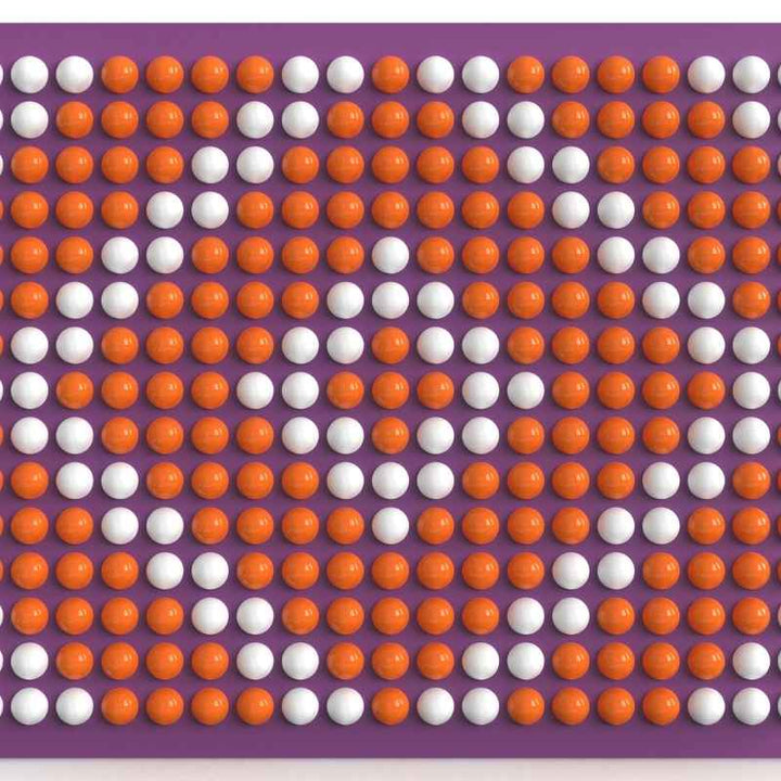 LiteZilla Spinfinity Wall interactive spinning wall panel displaying a custom orange and white pattern on a purple panel