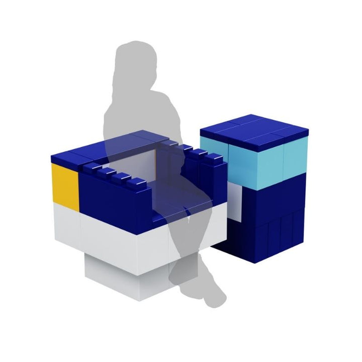 A chair and side table built with EverBlock Small Starter Kit modular building blocks, shown to scale beside a seated child