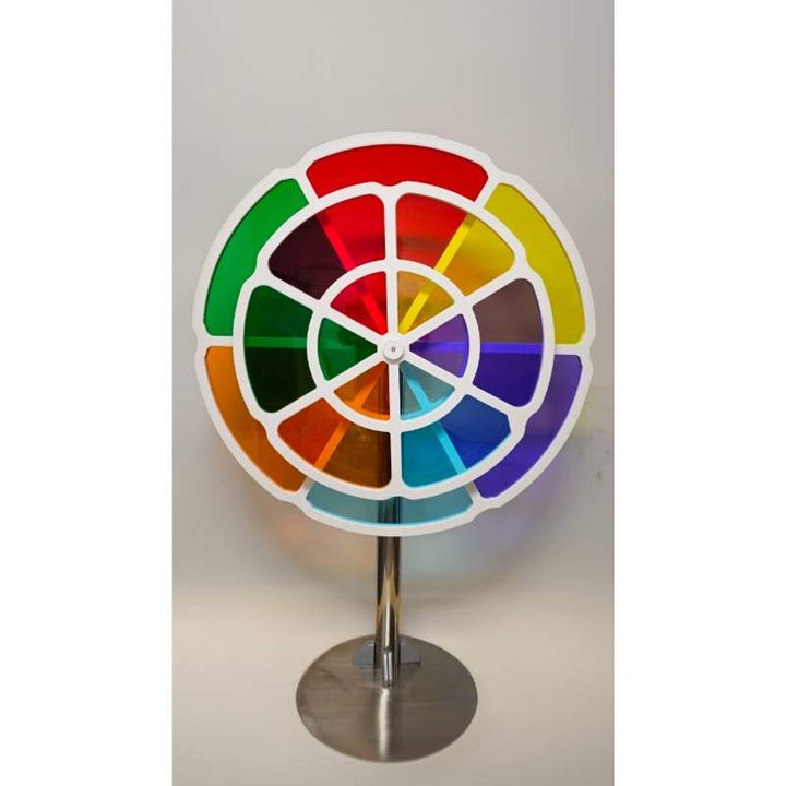 The LiteZilla ChromaWheel interactive STEM color wheel fully assembled on its freestanding pedestal base