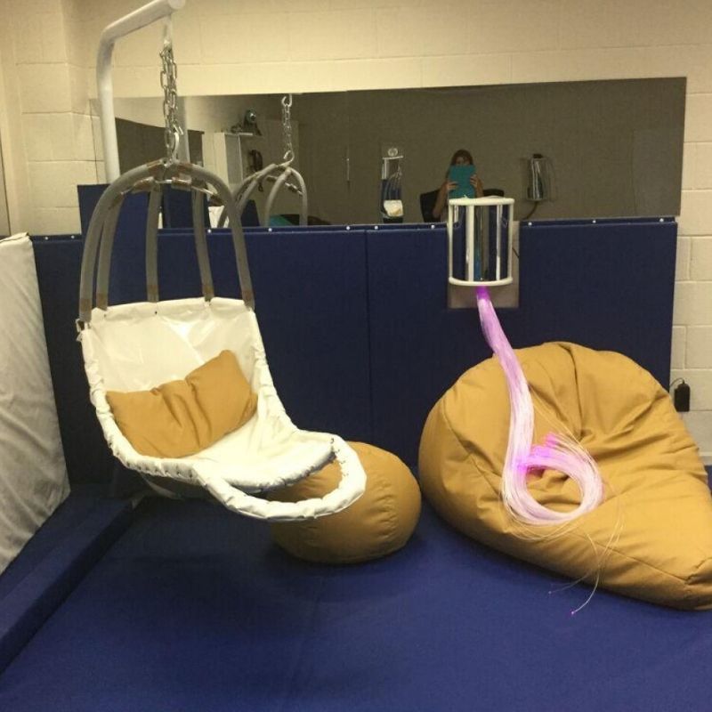 TFH Swaying Banana Leaf Chair in indoor use showing the leaf-shaped sensory swing suspended for calming vestibular input in a therapy or home setting