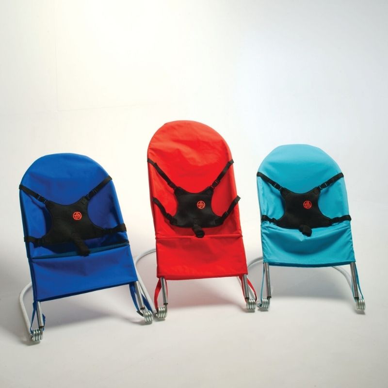 TFH Bouncing Chair shown in all four colour variants - light blue, dark blue, red, and green - illustrating the full sensory seating size range