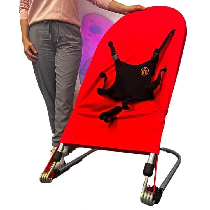 TFH Bouncing Chair large red variant front view, a therapeutic vestibular seat for children up to age 9 in therapy rooms and classrooms