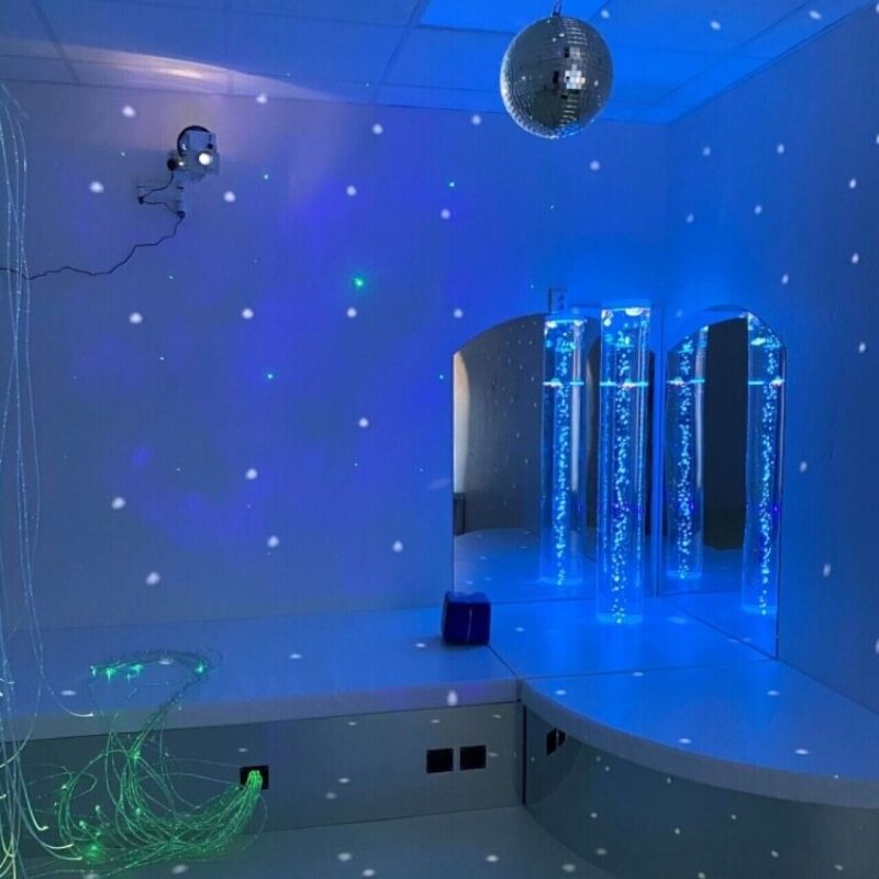TFH Bubble Tube Corner Seat Base sensory room corner installation in blue LED light