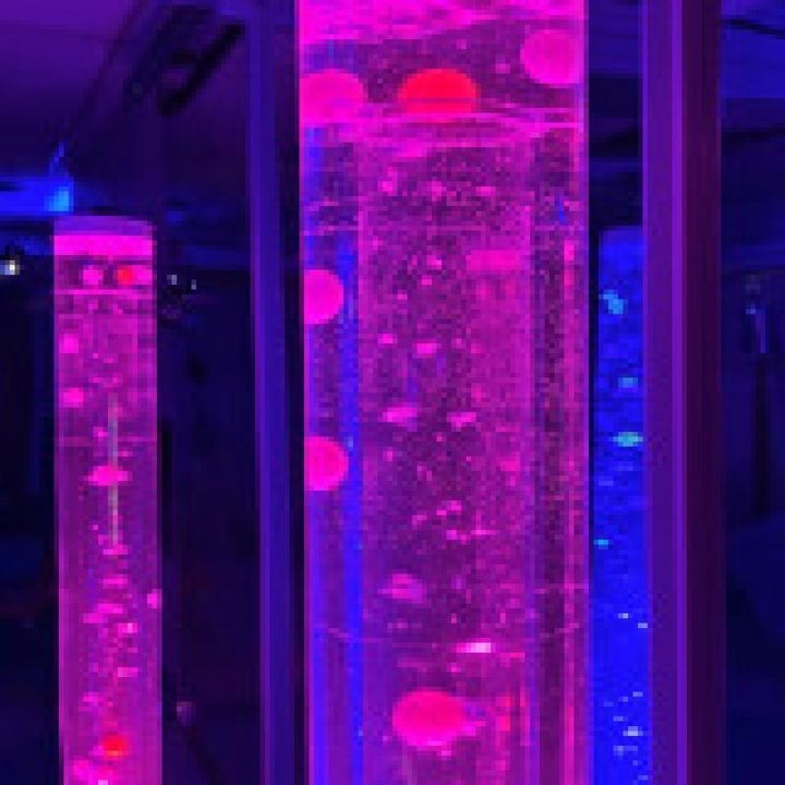 Close-up of TFH Standard Bubble Tube Insert showing cascading beads and balls in purple and blue LED light inside a 6-inch sensory bubble tube